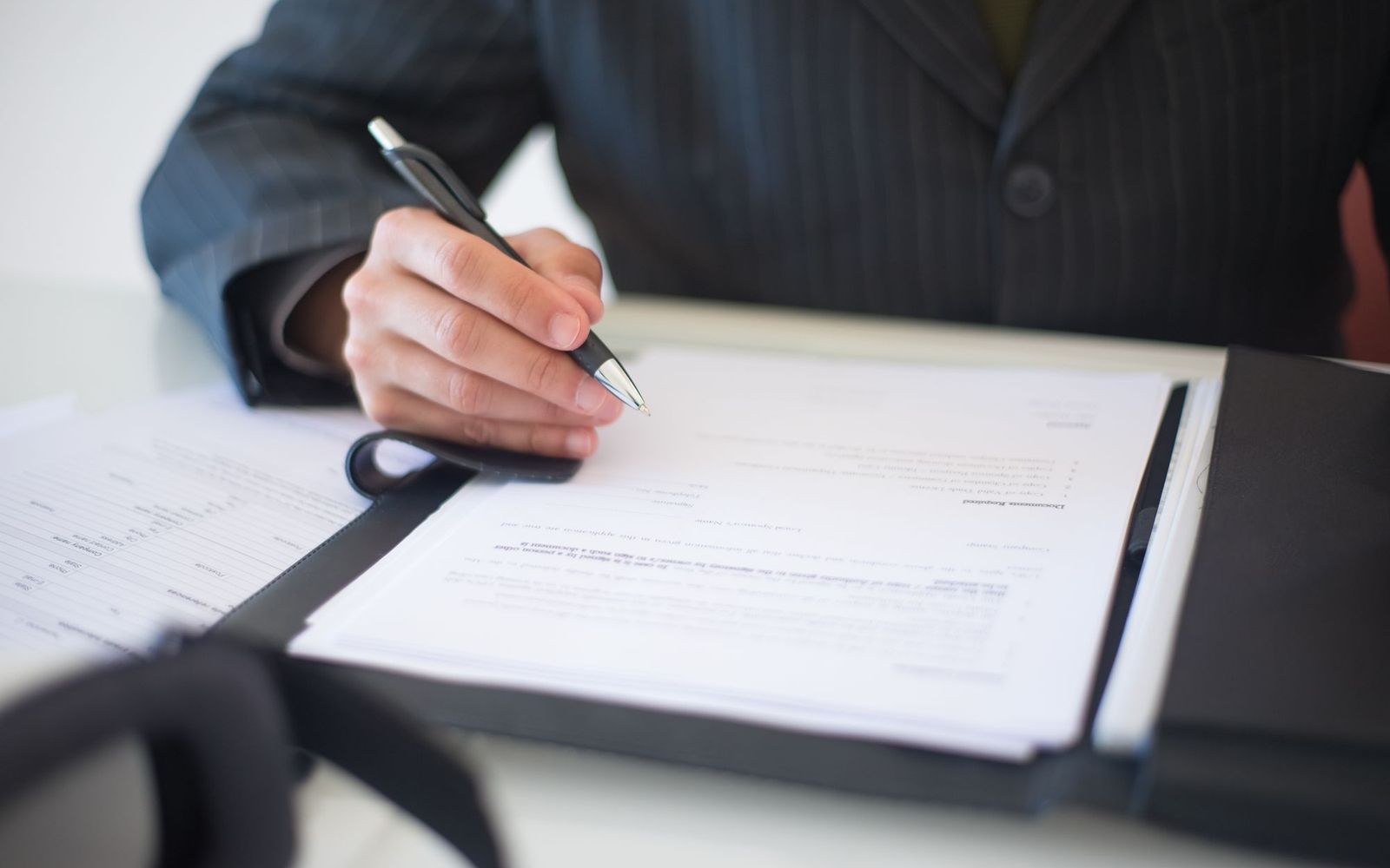 Two people in a small business meeting reviewing notes
