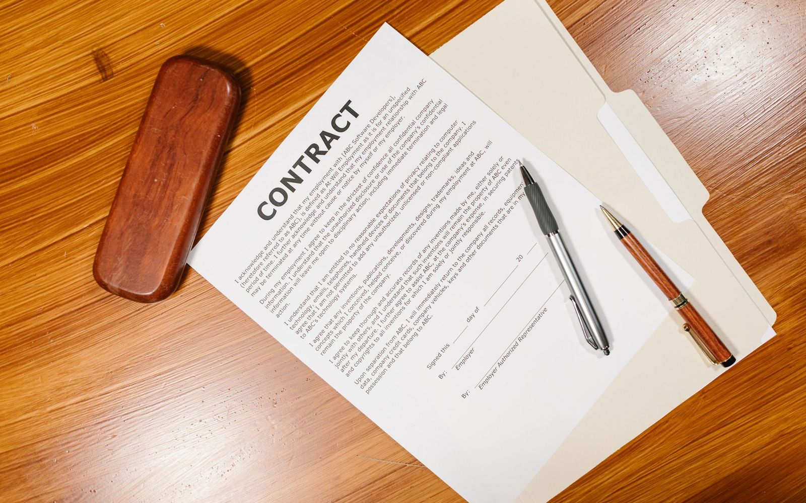 Two people in a small business meeting reviewing notes