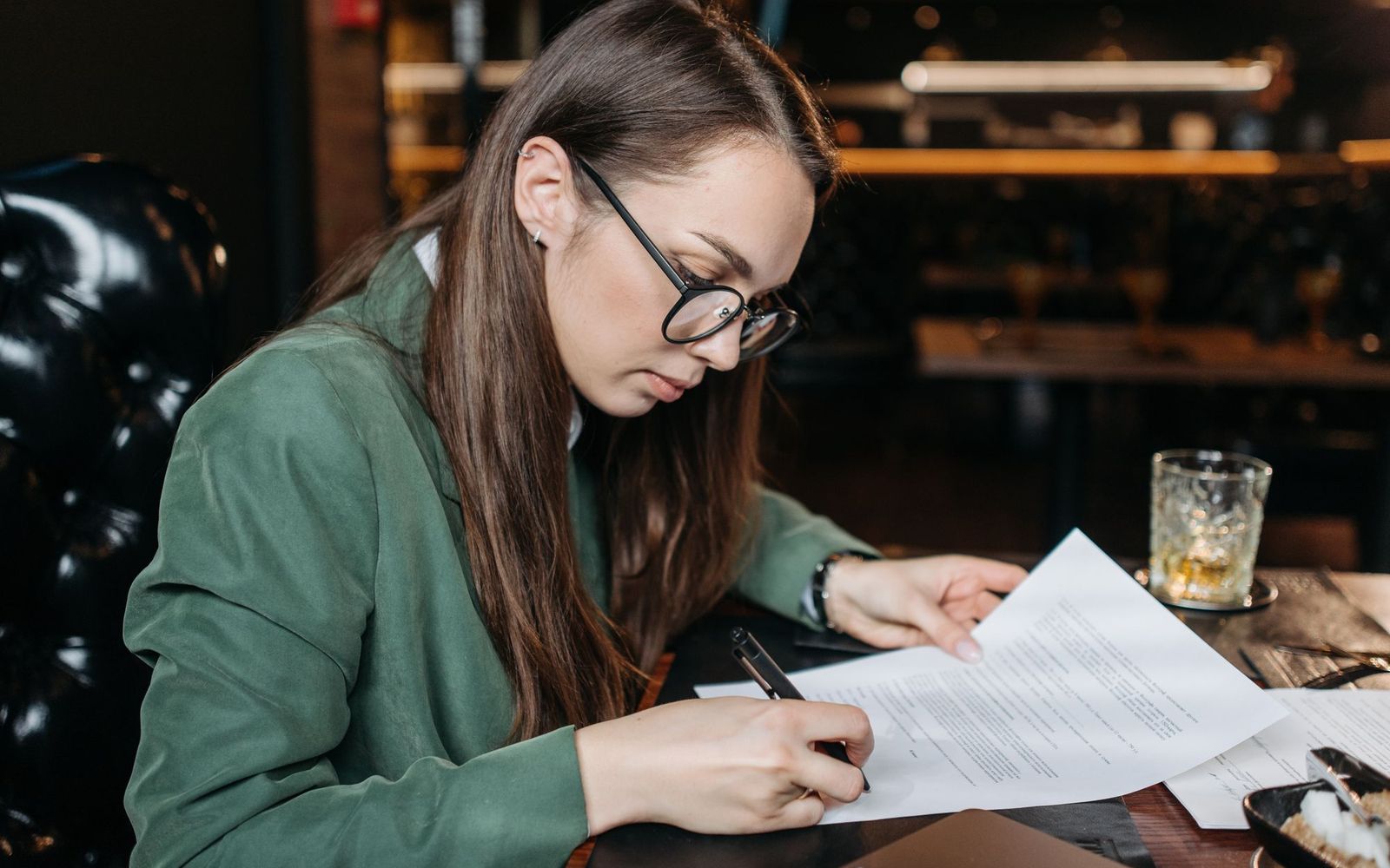 A laptop and a coffee cup on a kitchen table