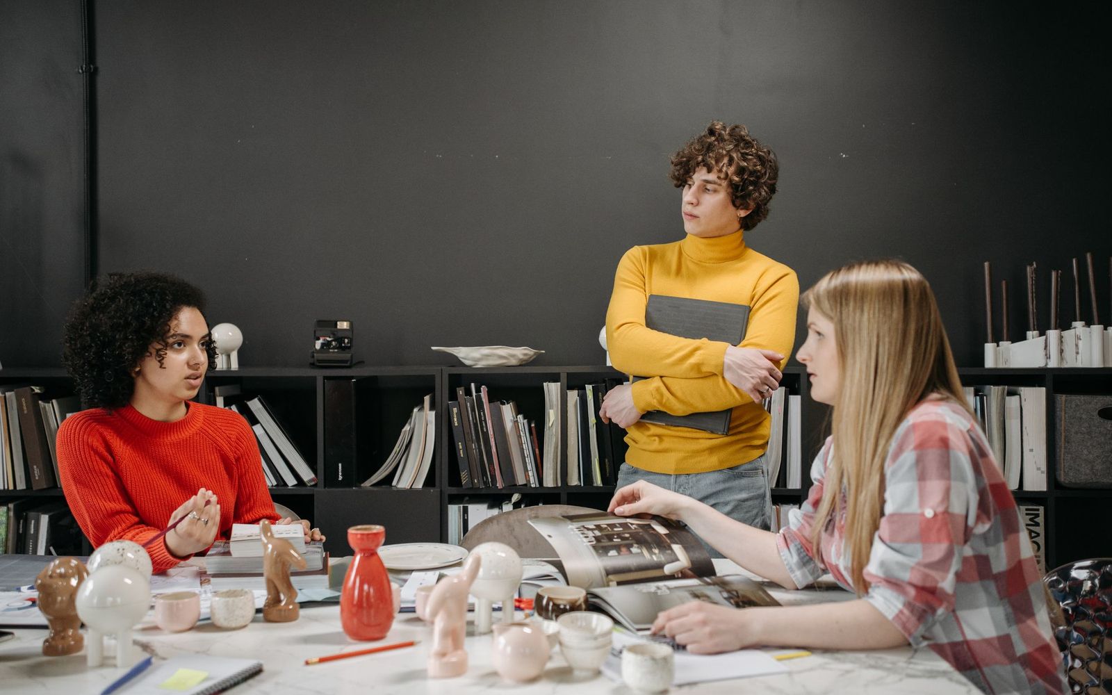 Two people in a small business meeting reviewing notes