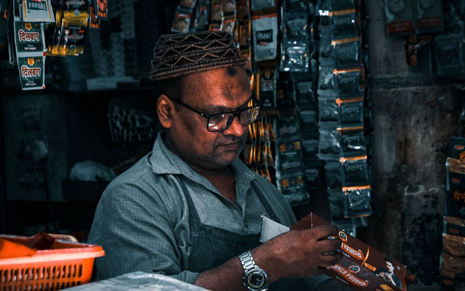 A tradesperson working with a drill in a workshop