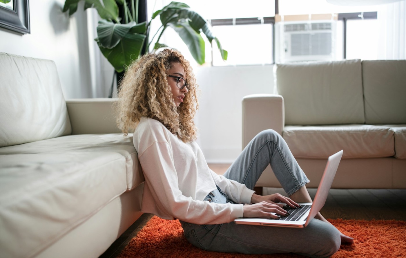A person working on a laptop at home