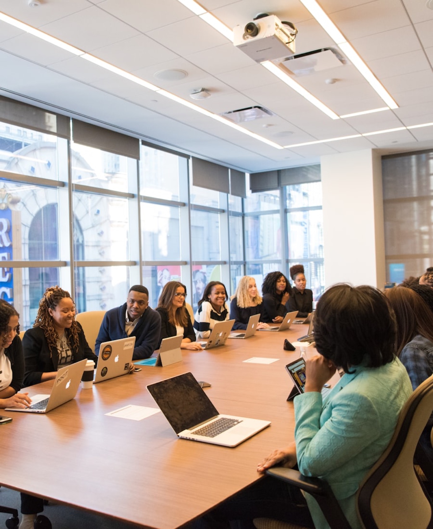 People around a table in a boardroom meeting